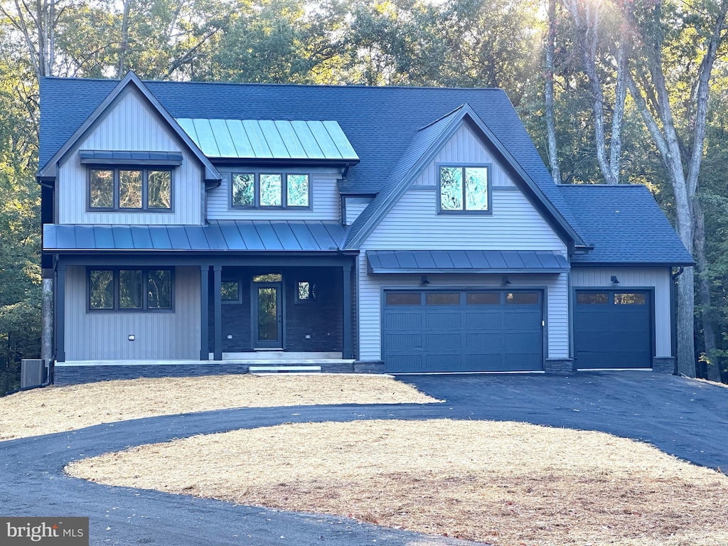 modern farmhouse style home with covered porch