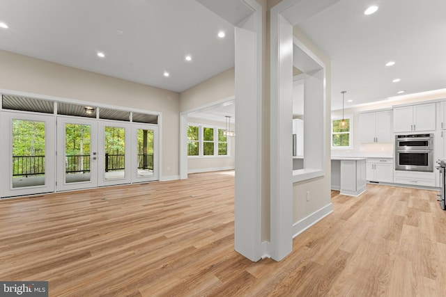 unfurnished living room with light hardwood / wood-style flooring