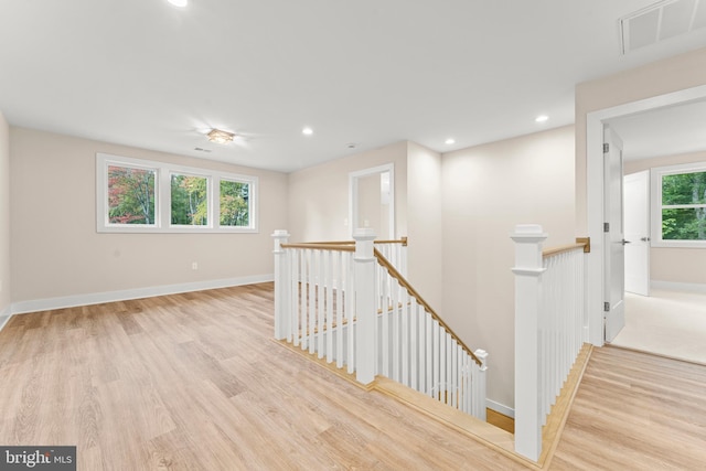 interior space with light hardwood / wood-style floors and plenty of natural light