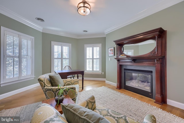 interior space with ornamental molding and light wood-style floors
