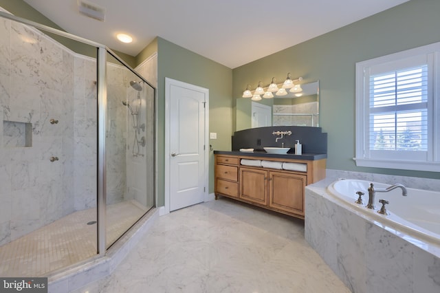 full bathroom with a stall shower, a bath, visible vents, marble finish floor, and vanity