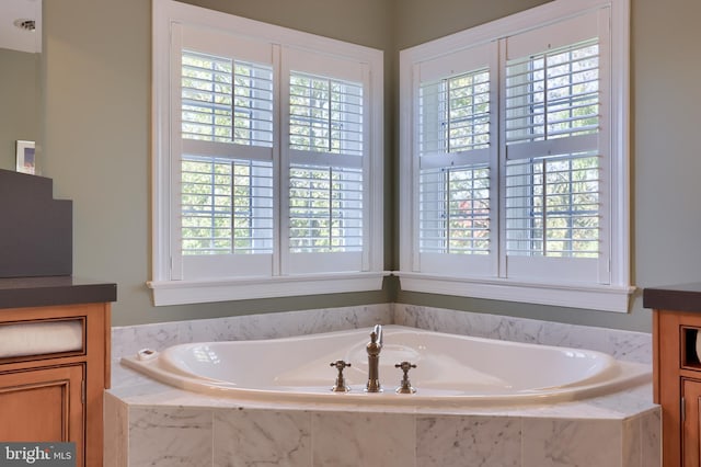 bathroom with a garden tub