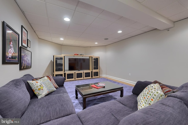 living room with recessed lighting, baseboards, carpet floors, and a paneled ceiling