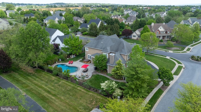 birds eye view of property with a residential view