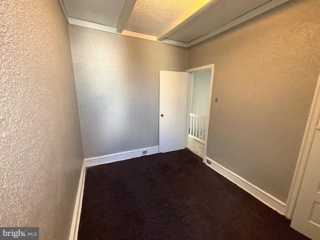 empty room featuring a textured ceiling