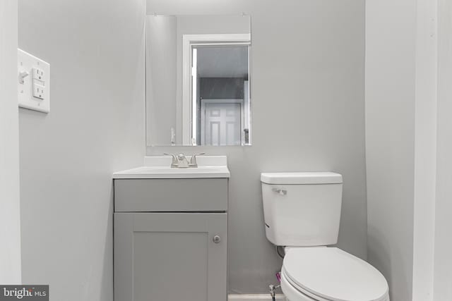 bathroom featuring toilet and vanity