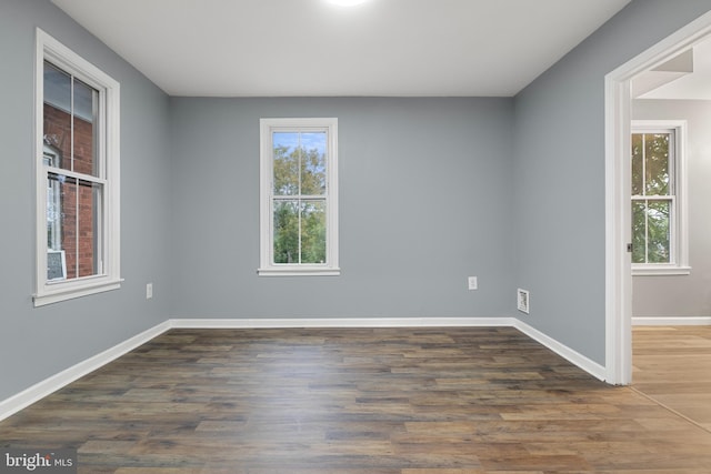 empty room featuring dark hardwood / wood-style floors