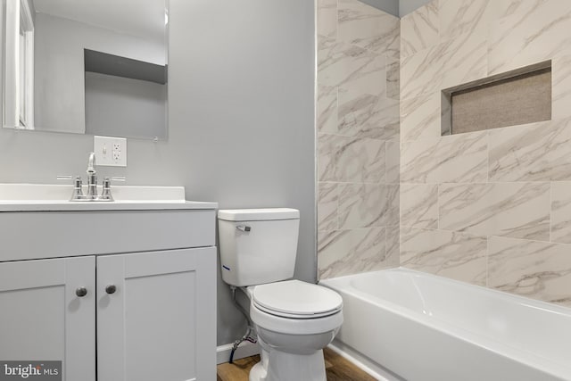 full bathroom featuring toilet, tiled shower / bath combo, vanity, and wood-type flooring