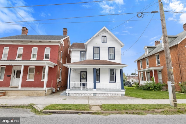 view of front of home featuring a front lawn and covered porch