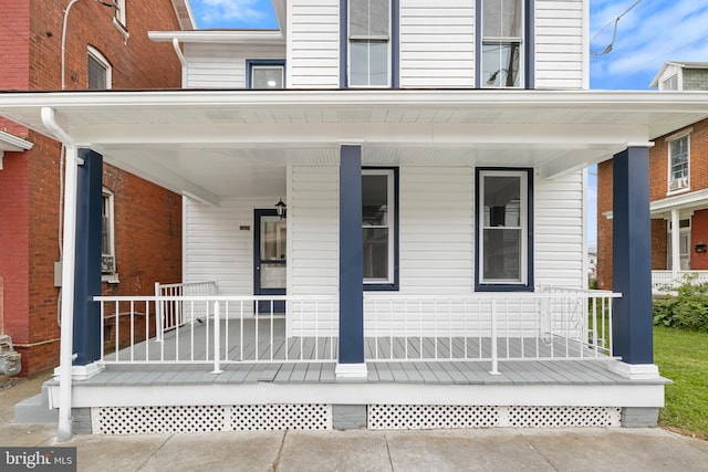 doorway to property with covered porch