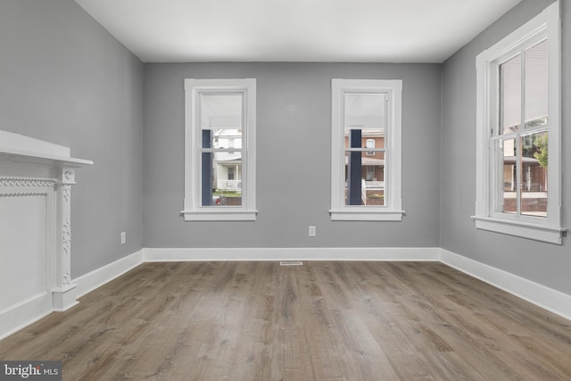 unfurnished living room with hardwood / wood-style flooring