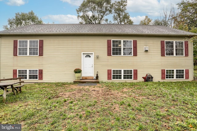 raised ranch with a front lawn