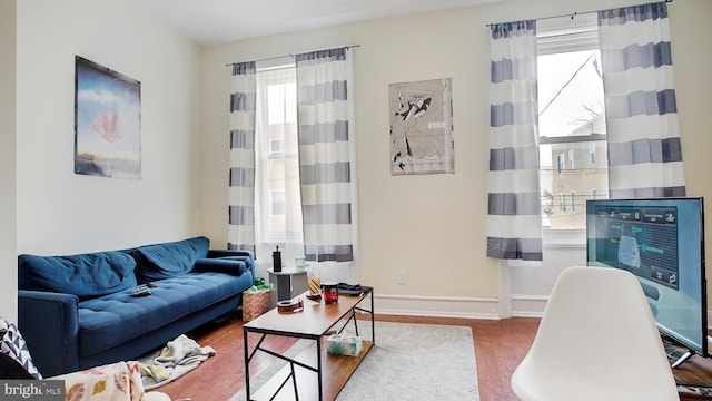 living room featuring heating unit and hardwood / wood-style floors