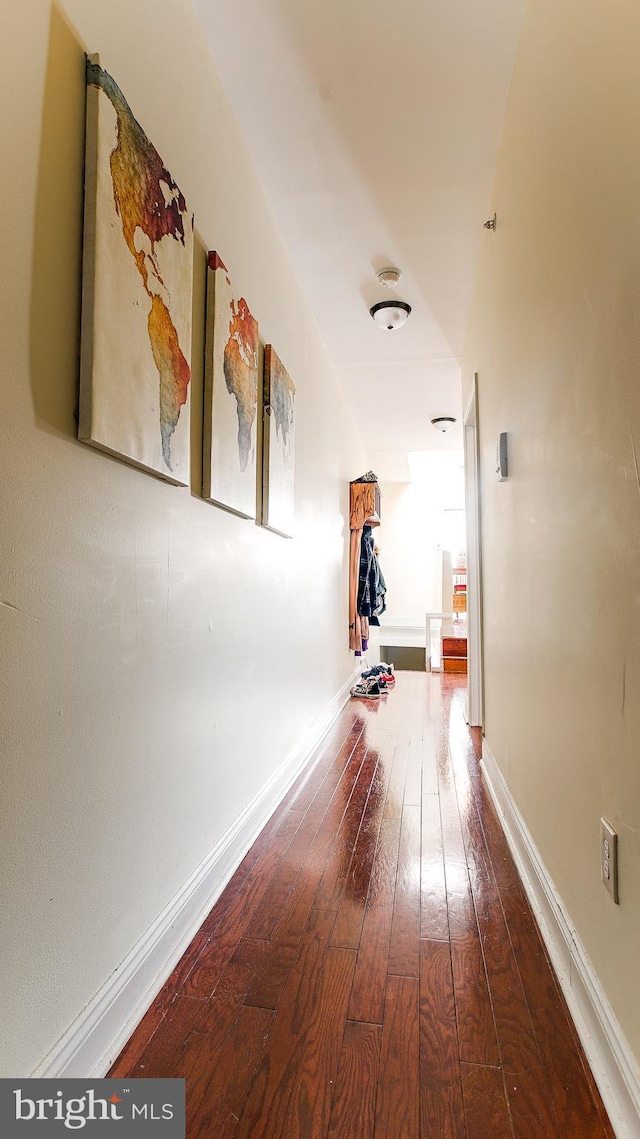 corridor featuring hardwood / wood-style floors