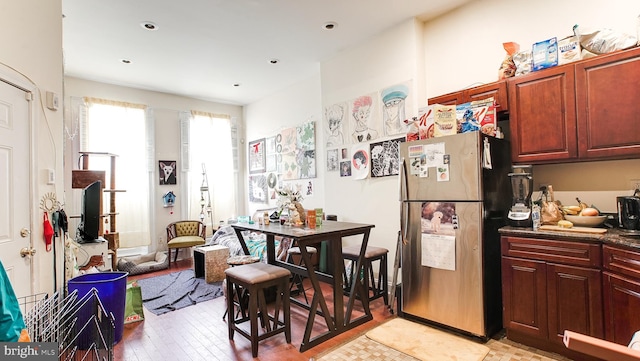 kitchen with stainless steel refrigerator and light wood-type flooring