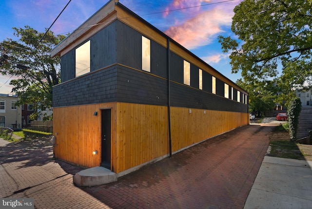 view of property exterior at dusk