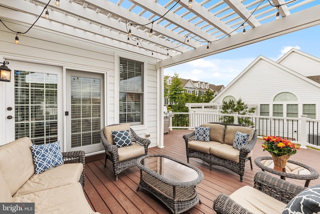 wooden terrace featuring an outdoor living space and a pergola