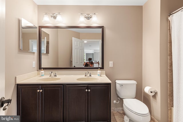 bathroom featuring tile patterned flooring, vanity, toilet, and a shower with shower curtain