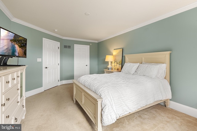 bedroom featuring crown molding and light carpet