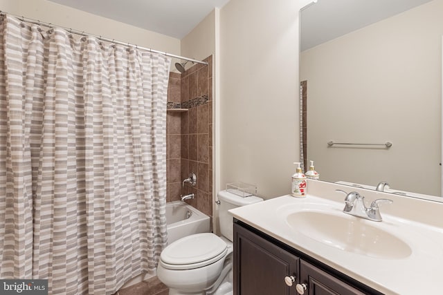 full bathroom with shower / tub combo with curtain, vanity, and toilet