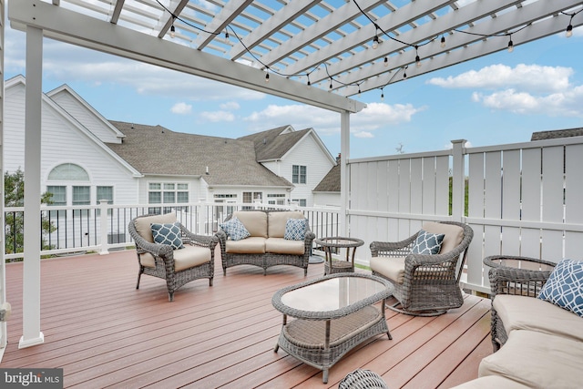 wooden deck featuring a pergola and an outdoor living space