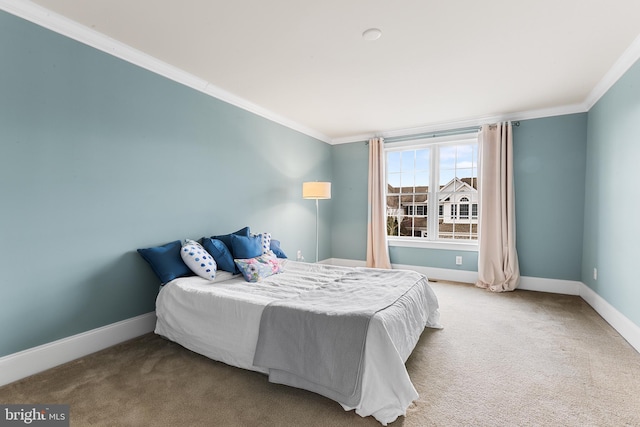 bedroom featuring carpet floors and crown molding