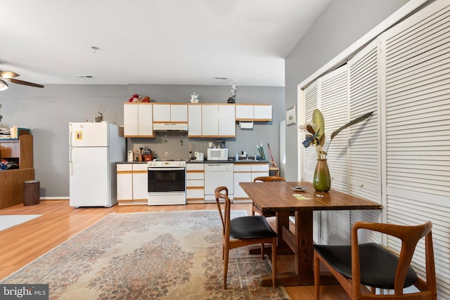 kitchen with ceiling fan, sink, light hardwood / wood-style flooring, white appliances, and white cabinets