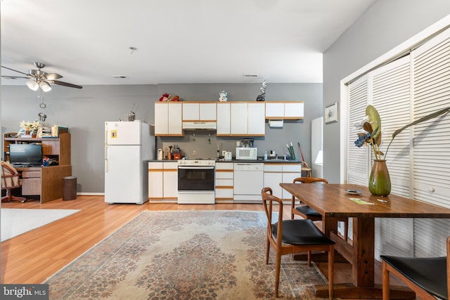 kitchen with white appliances, ceiling fan, sink, light hardwood / wood-style flooring, and white cabinetry