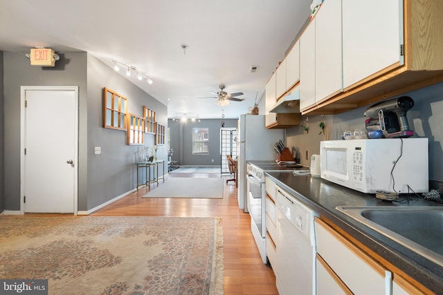 kitchen with white appliances, sink, light hardwood / wood-style flooring, ceiling fan, and white cabinetry