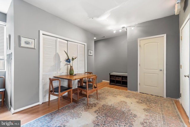 dining room with wood-type flooring