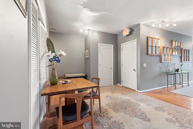 dining area with hardwood / wood-style floors