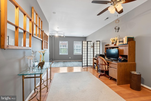 office space featuring ceiling fan and light wood-type flooring