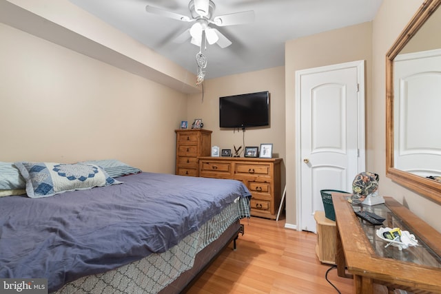 bedroom featuring light wood-type flooring and ceiling fan