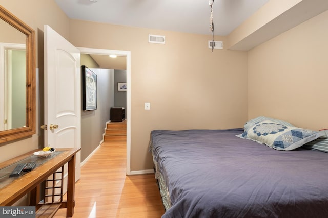 bedroom with light hardwood / wood-style floors