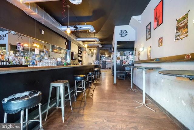 bar featuring wood-type flooring