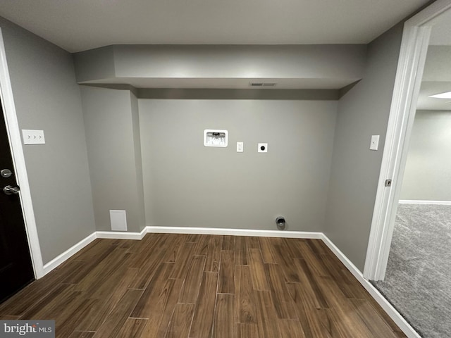 clothes washing area featuring washer hookup, hookup for an electric dryer, and dark hardwood / wood-style floors