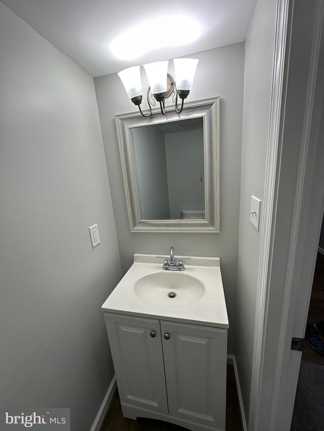 bathroom featuring vanity and a notable chandelier