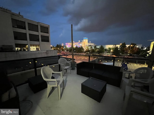 view of patio / terrace with a balcony and an outdoor hangout area