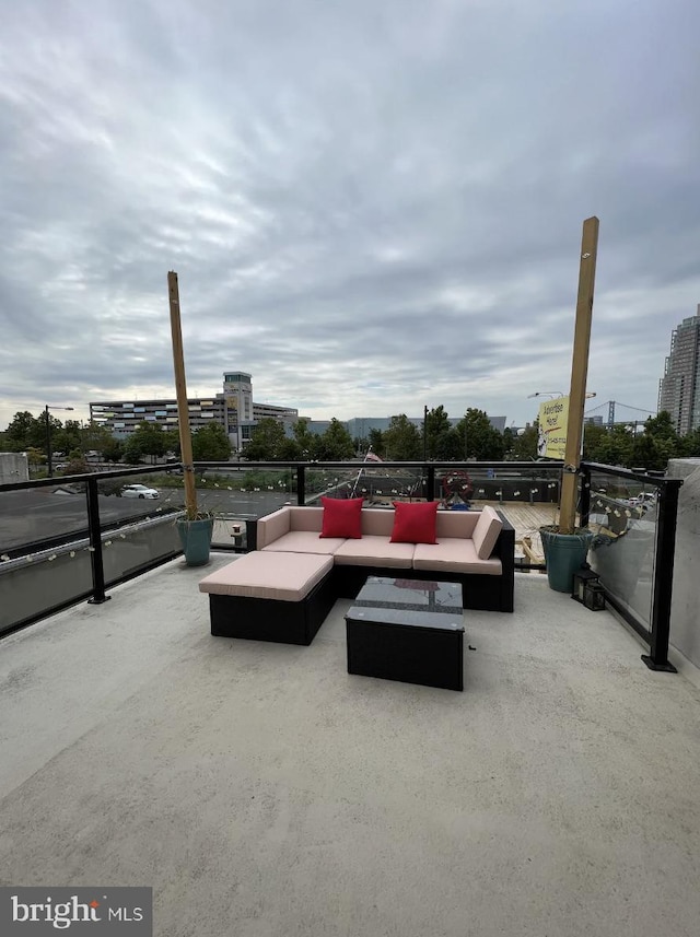 view of patio featuring an outdoor hangout area and a balcony