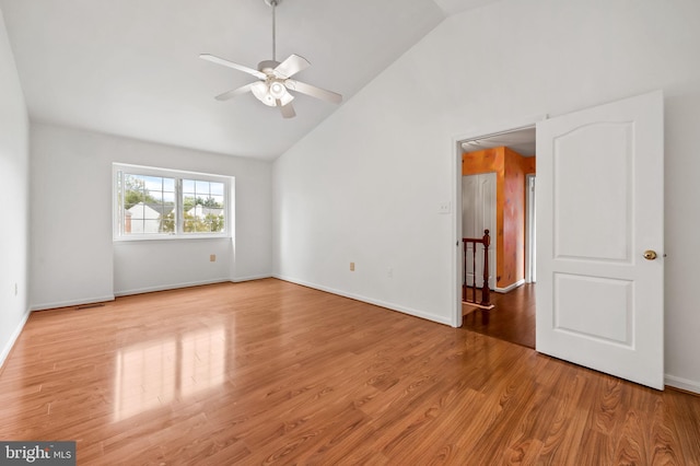 spare room featuring ceiling fan, light hardwood / wood-style floors, and high vaulted ceiling