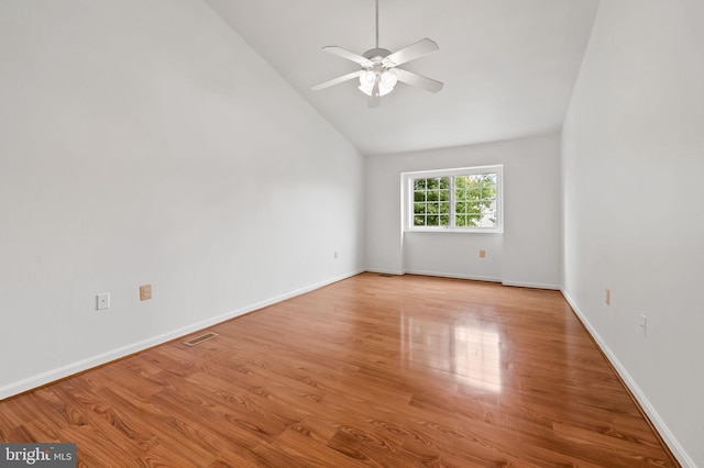 unfurnished room featuring ceiling fan, hardwood / wood-style flooring, and high vaulted ceiling