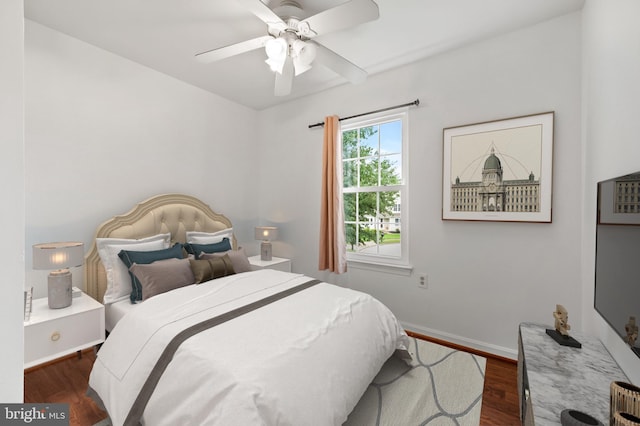 bedroom featuring ceiling fan and dark hardwood / wood-style flooring