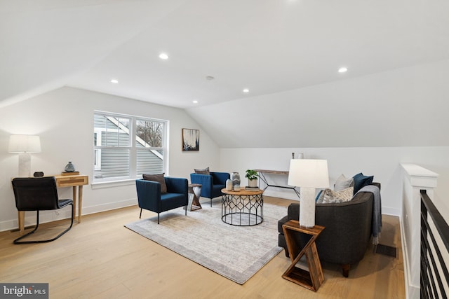 sitting room with light hardwood / wood-style flooring and vaulted ceiling