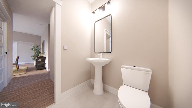 bathroom featuring tile patterned flooring and toilet