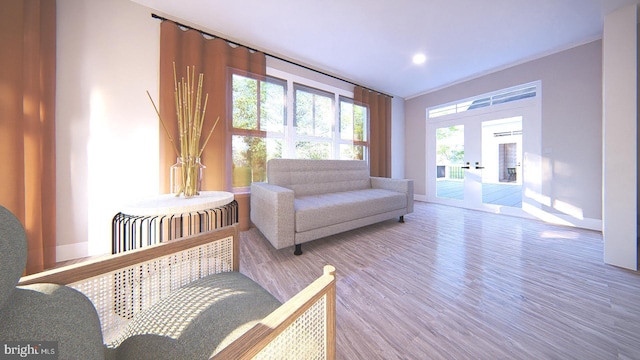 sitting room with french doors and hardwood / wood-style floors