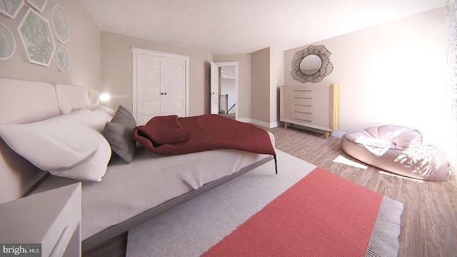 bedroom featuring a closet and light hardwood / wood-style floors