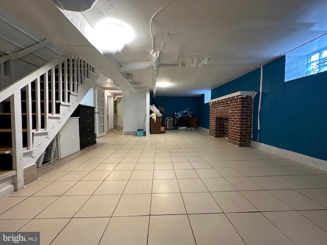 basement featuring light tile patterned flooring