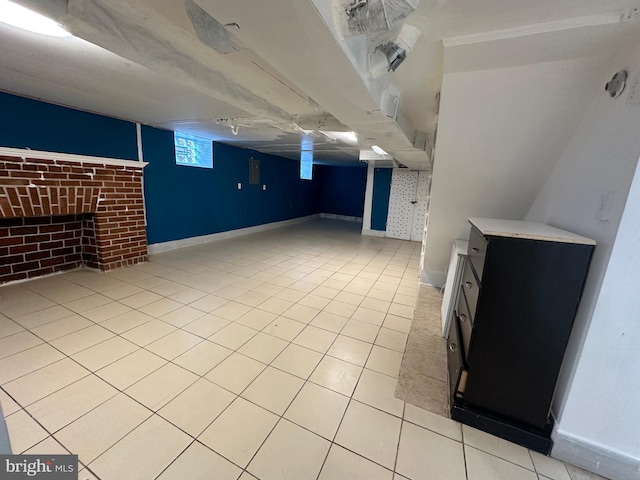 basement featuring light tile patterned floors