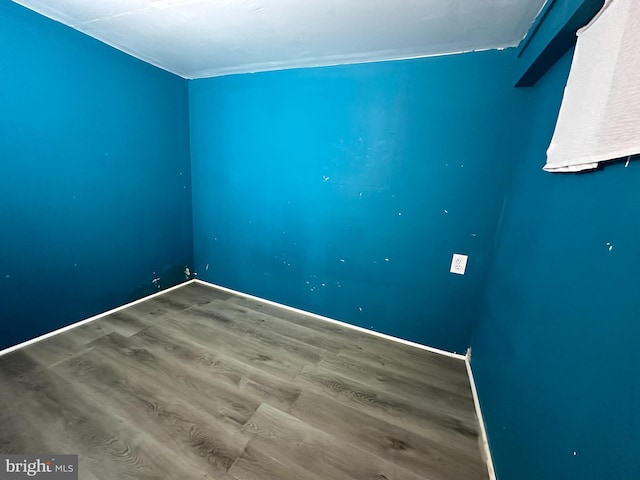 spare room featuring hardwood / wood-style floors