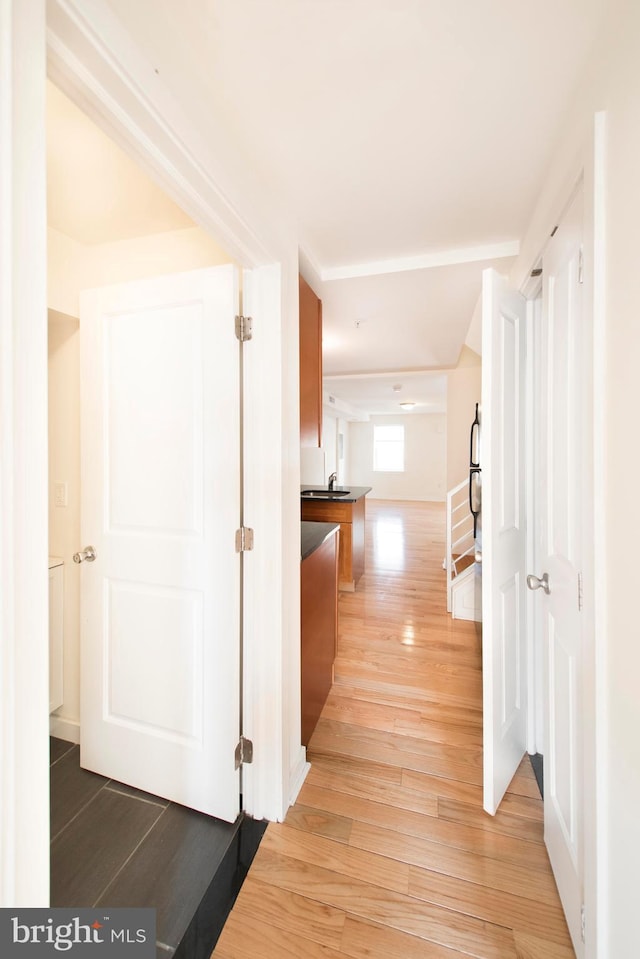 hallway with light wood-type flooring